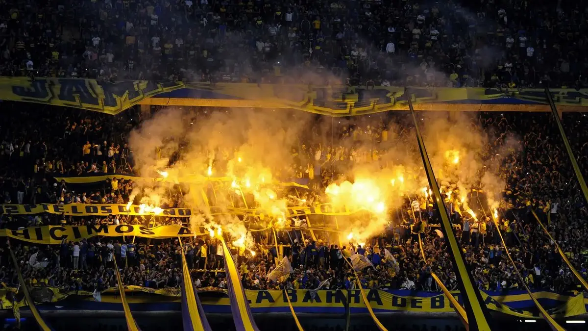 Boca fans with flares in the stands.