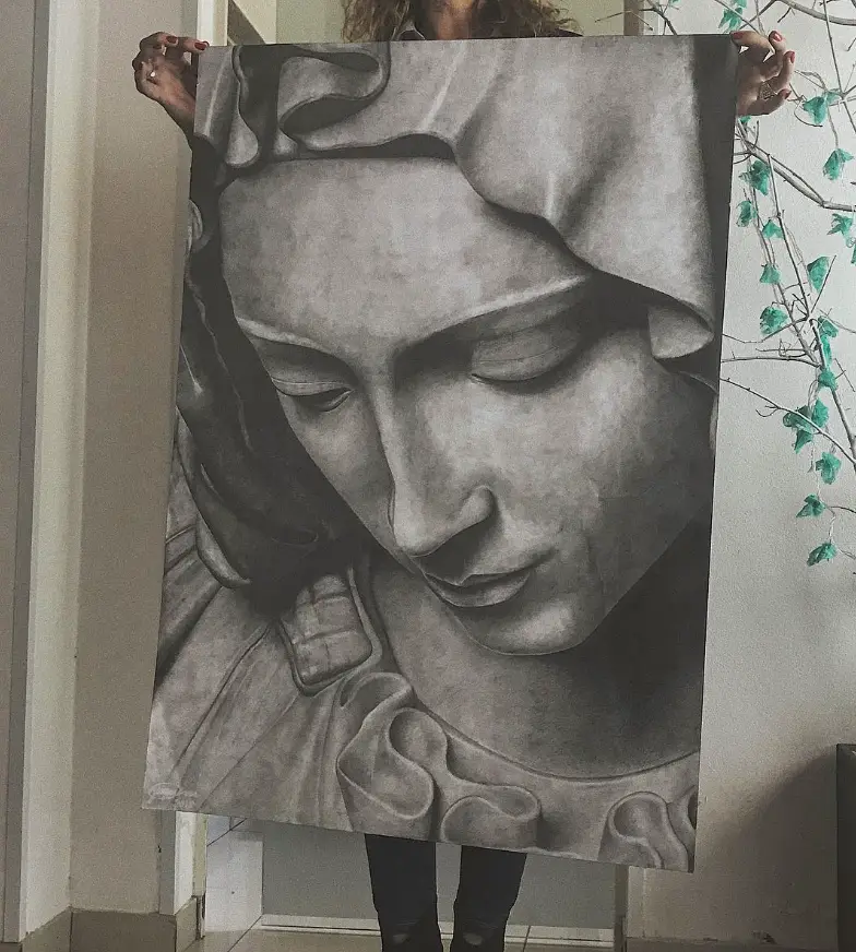 A large graphite drawing of a veiled face.